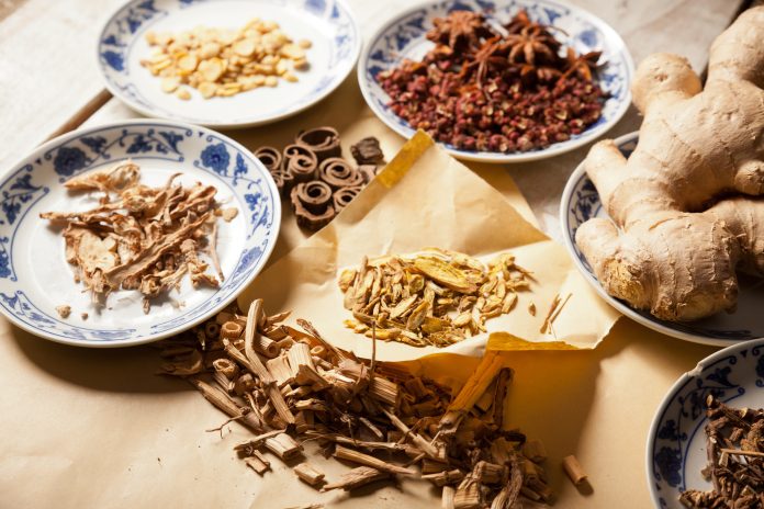 Ancient Chinese medical books in the Qing Dynasty, the Chinese herbal medicine on the table