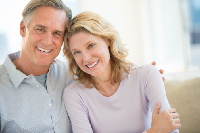 Portrait of mature couple smiling together at home