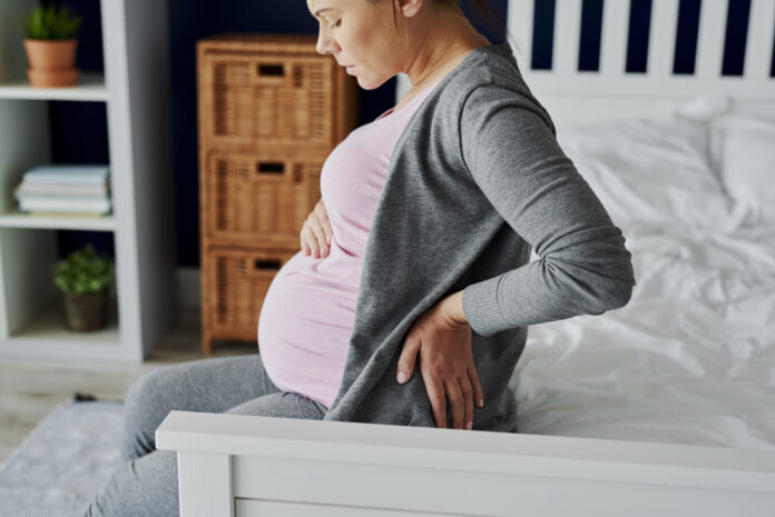 Pregnant woman feeling pain in the back