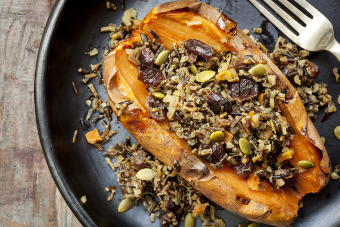 Baked sweet potato or yam, stuffed with wild rice, pepitas, and cranberries.
