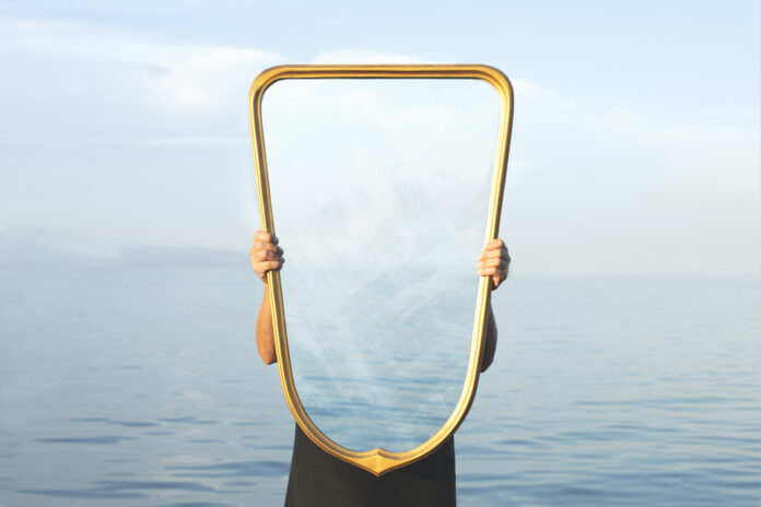 surreal image of a transparent mirror; concept of door to freedom