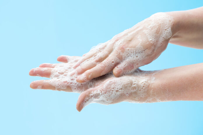Washing hands with soap to prevent germs, bacteria or viruses. Cleaning hands. Hygiene concept