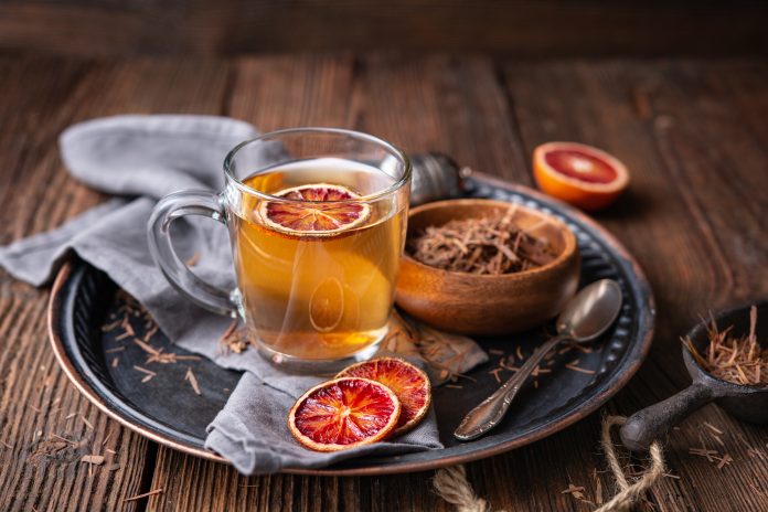 Medicinal Pau d'Arco bark tea also known as Lapacho in a glass cup on wooden background