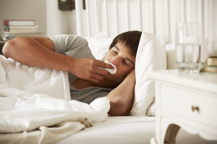 Sick Teenage Boy In Bed